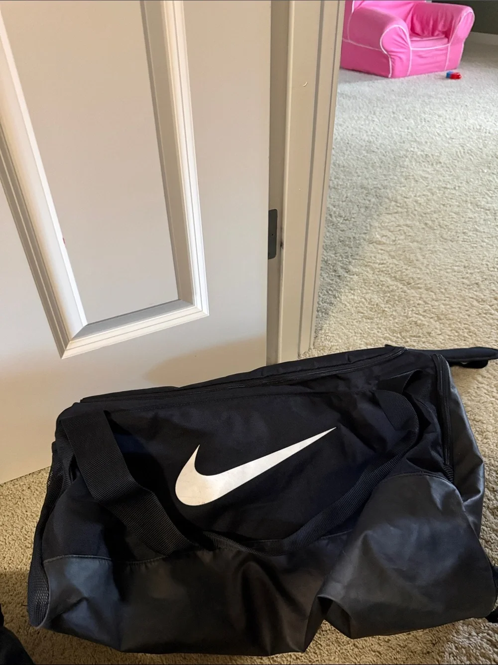 Nike Black Duffle Bag with White Swoosh and Adjustable Strap
